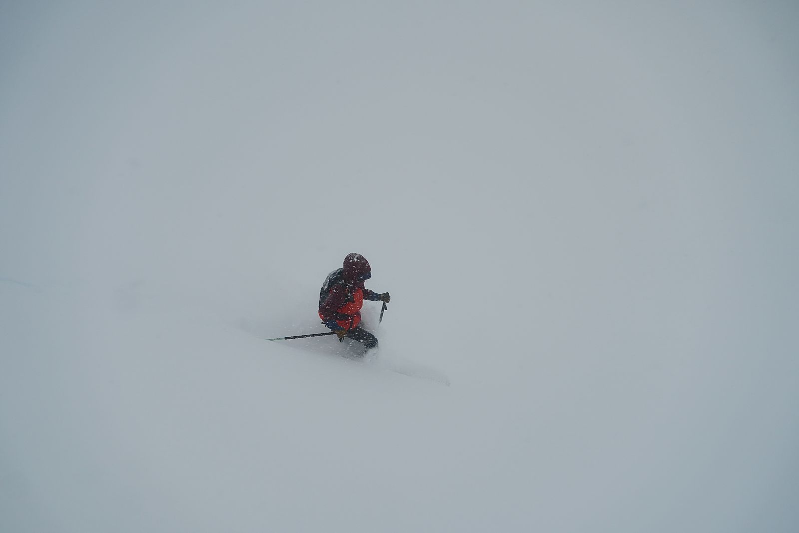Jordan skiing deep snow in a whiteout in Heaven's Half Pipe below Lone Peak