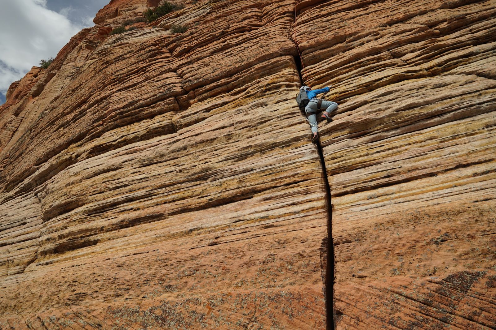 Jordan climbing the 5.7 hand crack high on Cowboy Ridge, Mount Kinesava, in Zion
